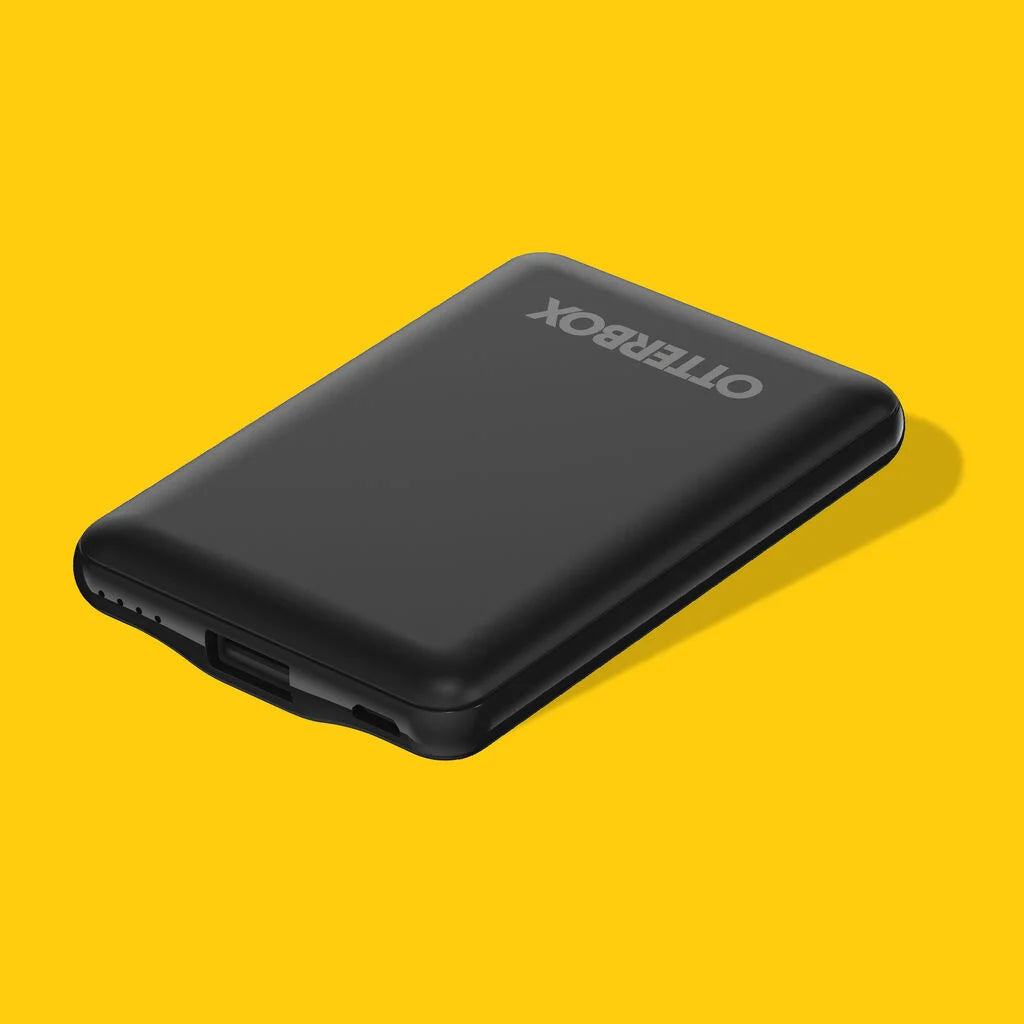 Black OtterBox device on a yellow background