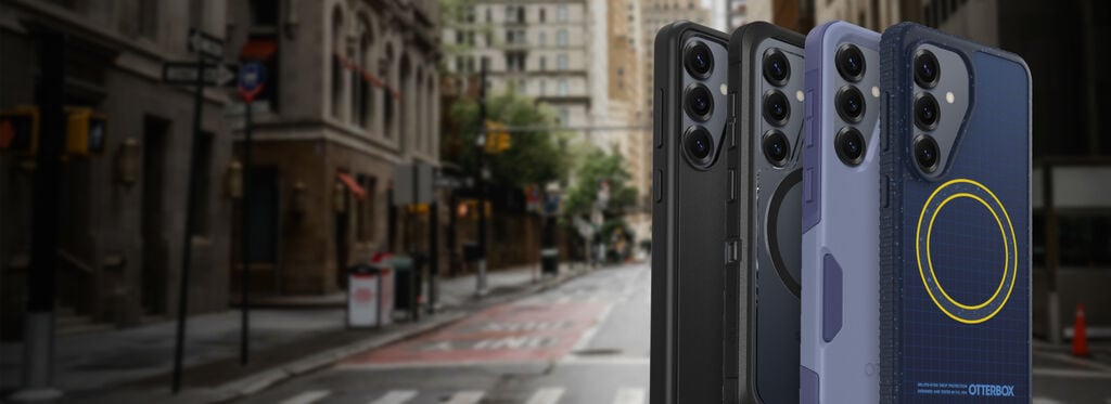 Three smartphones displayed against a city street background