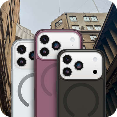Three Symmetry Series phone cases in different colors with a cityscape background
