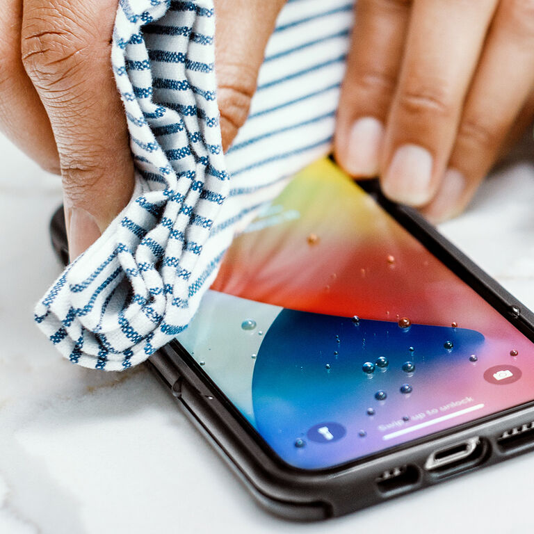 cloth wiping down phone display